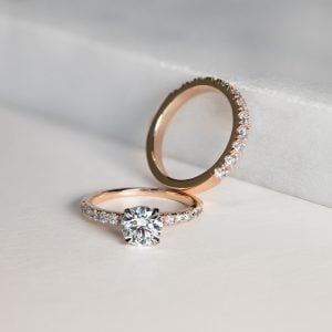 A couple's engagement ring in gold with diamonds