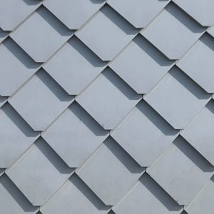 Perfectly aligned grey tiles on a roof