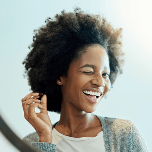 Dental, bnpl humm, Attractive young woman admiring herself with smile Attractive young woman admiring herself with smile