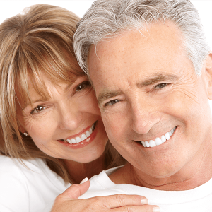Happy elderly couple with healthy white smile