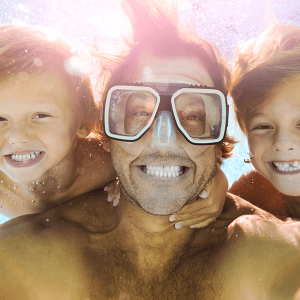 Dad and Sons Having Fun Doing A Selfie Underwater