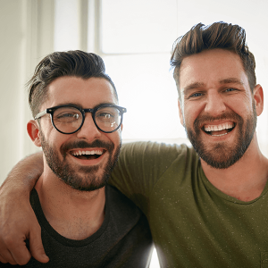 Portrait of two happy colleagues working together in a creative office