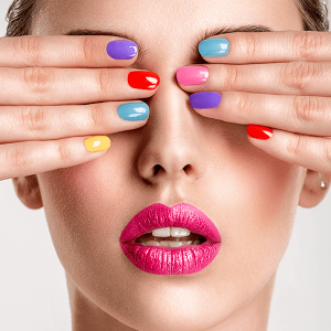 Beautiful fashion woman with a colored nails